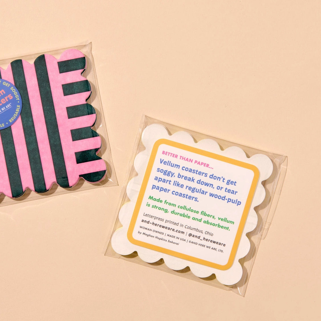 Packaged pink and black striped items with a label on a beige background
