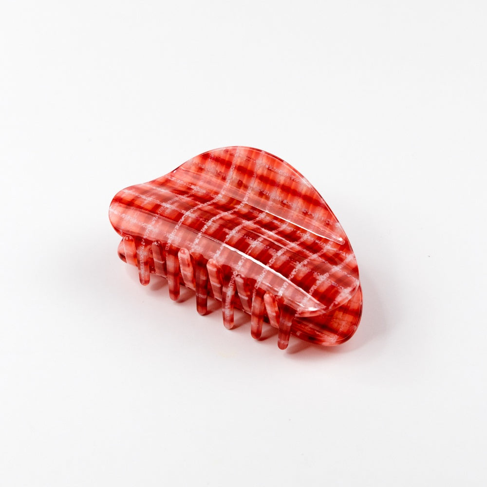 Red and white checkered hair claw on a white background