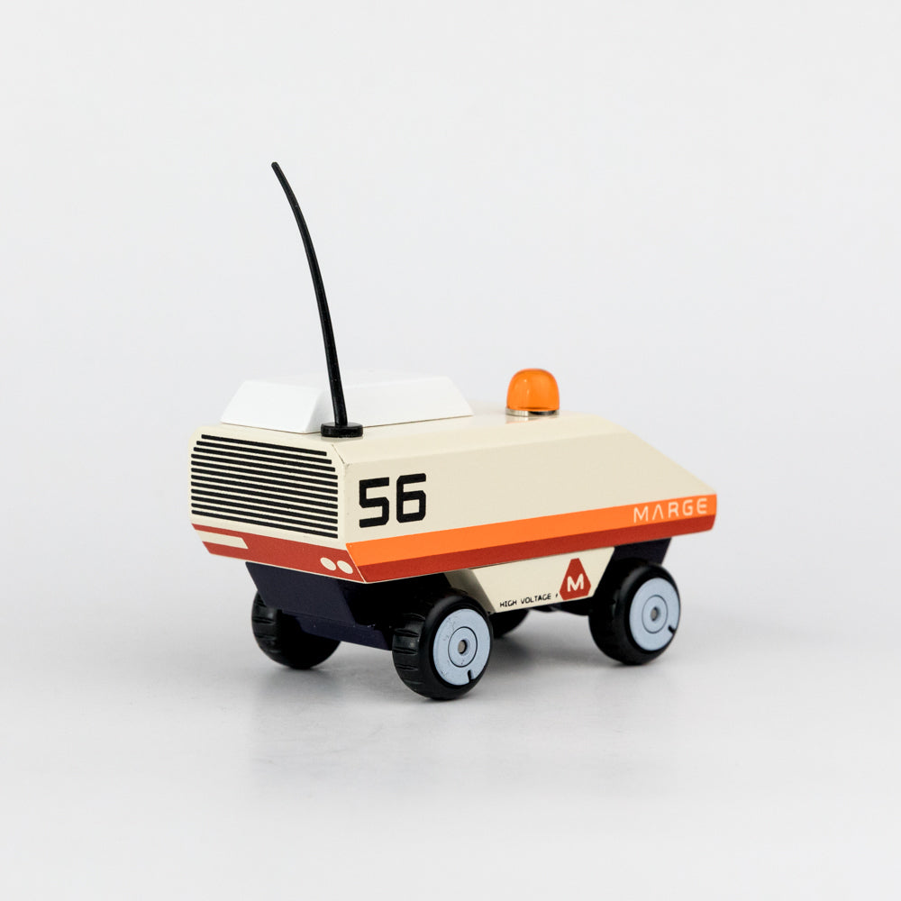 Toy robot with '56 MARGE' branding on a white background