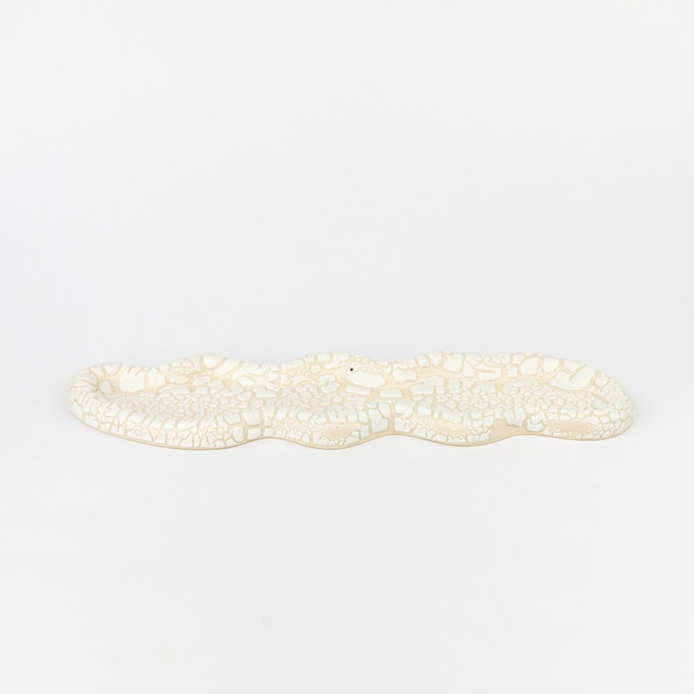 Decorative white stone mosaic on a light gray background