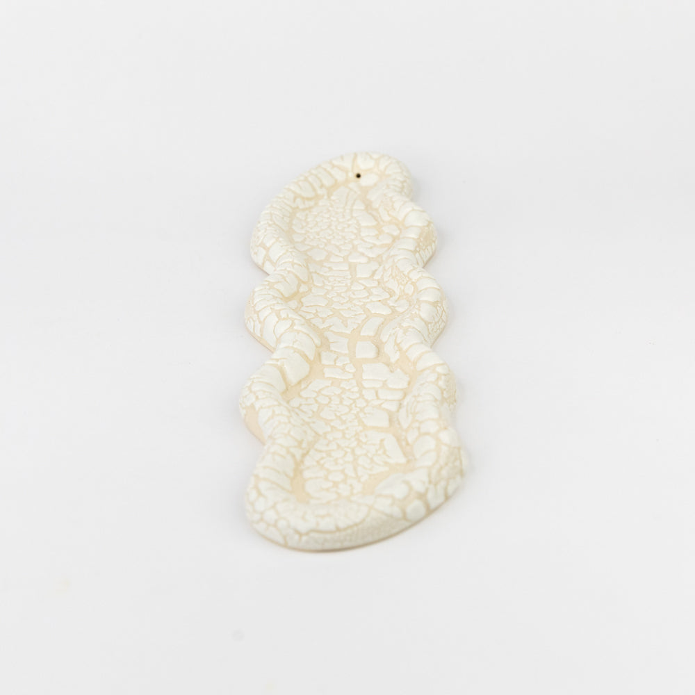 White textured bunny-shaped tray on a light gray background