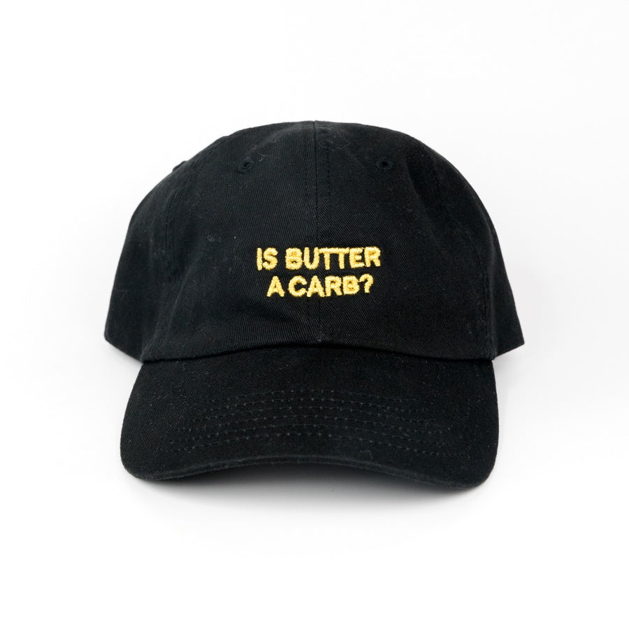 Black cap with yellow text 'IS BUTTER A CARB?' on a white background