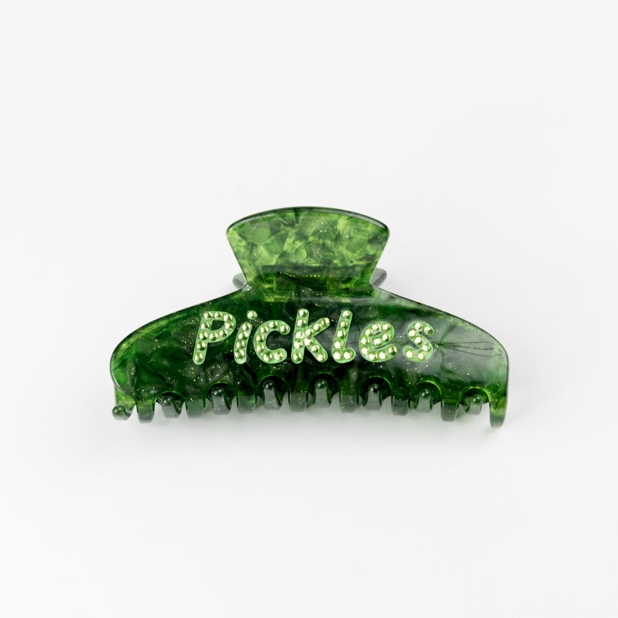 Green hair clip with 'Pickles' rhinestone text on a white background