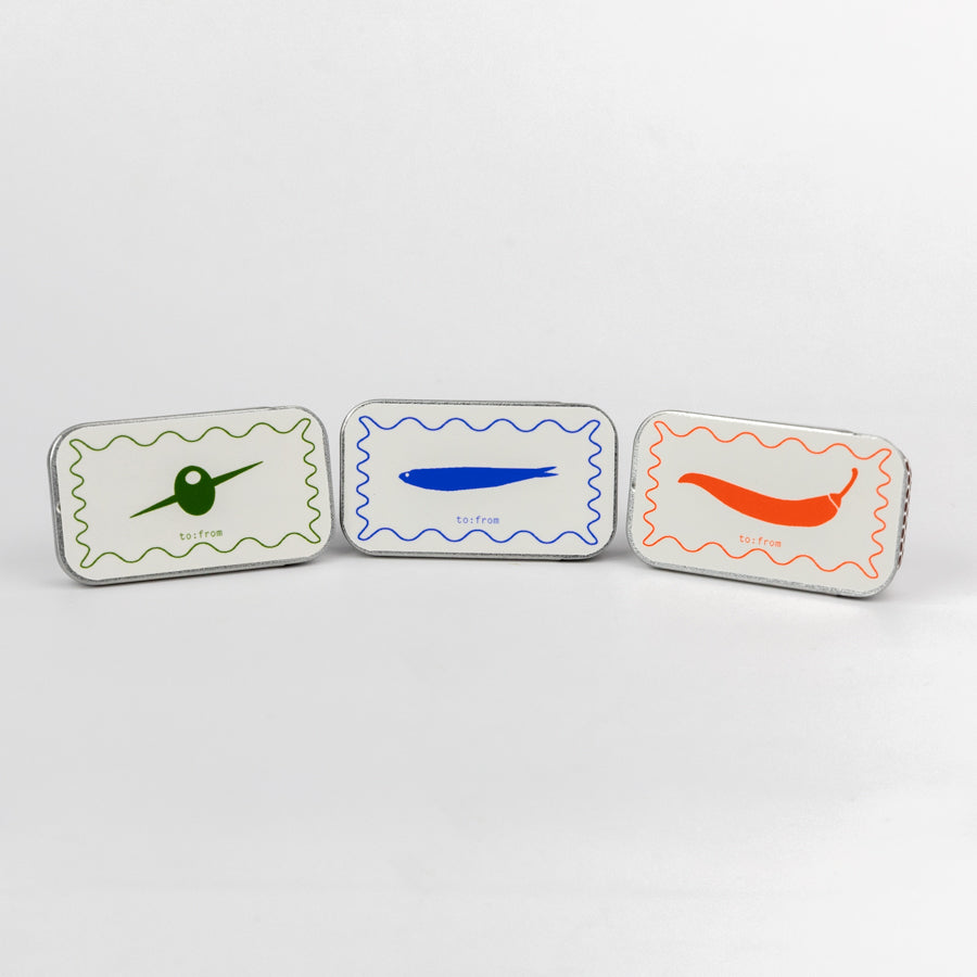 Three small rectangular containers with colorful designs on a white background