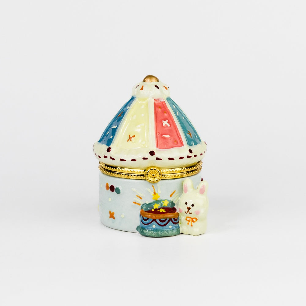 Decorative ceramic box with a lid on a white background