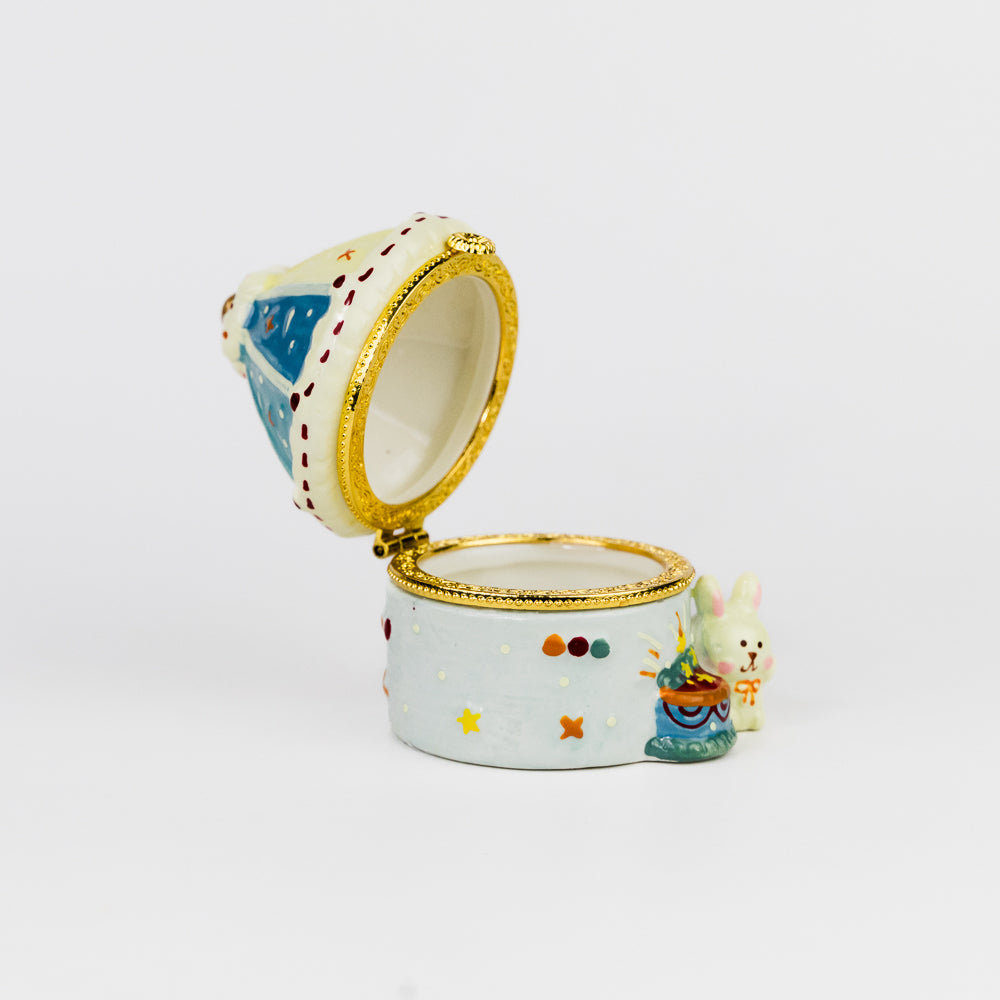Decorative ceramic box with a lid on a white background