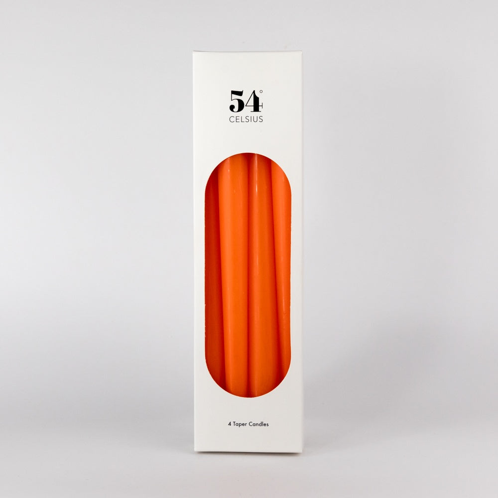 Four orange candles on a white background