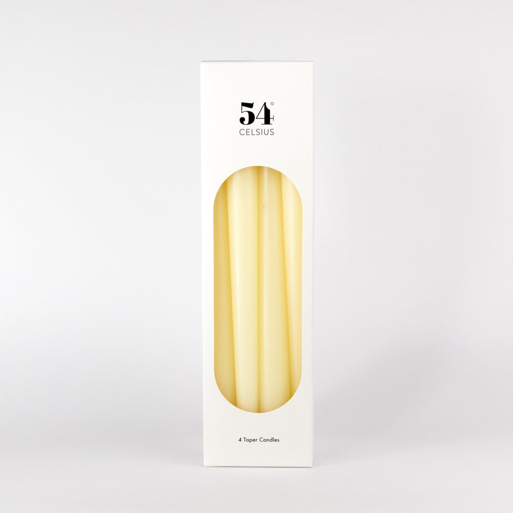 Four white candles on a light gray background