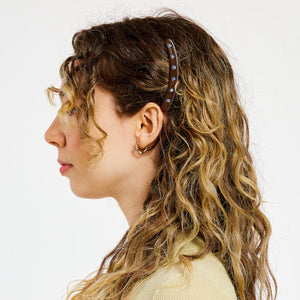 Woman with hair clip on a white background