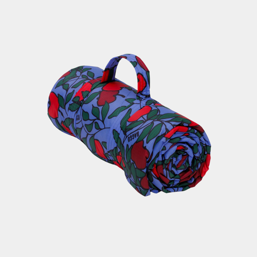 Roll-up mat with floral pattern on a light gray background