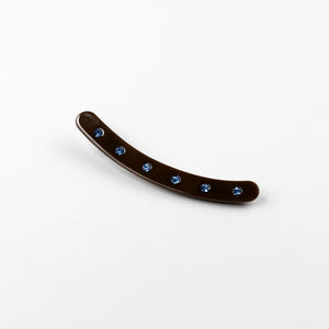 Dark Brown curved hair clip with blue gemstones on a white background