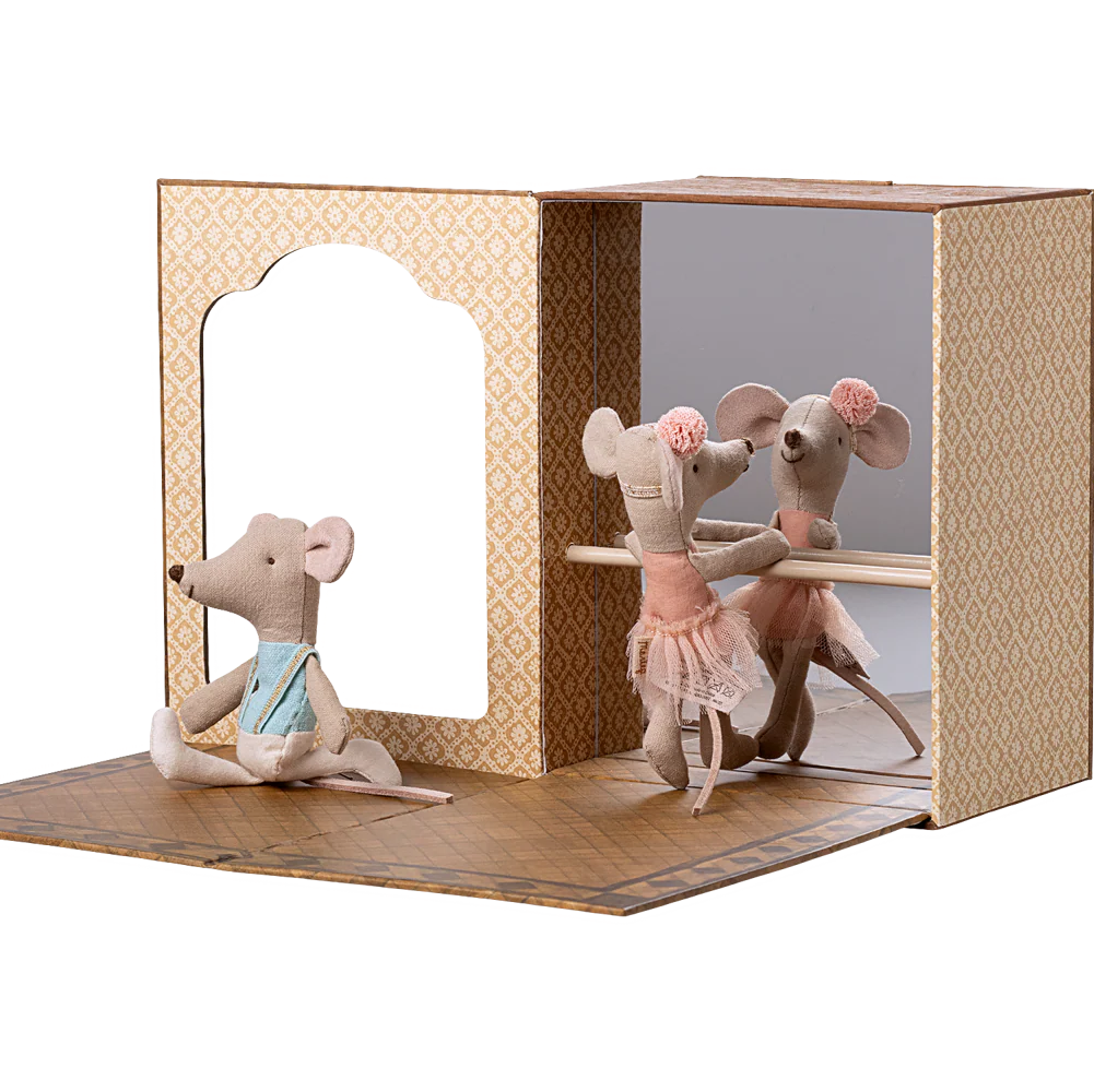 Toy mouse figures in a display case with a white background