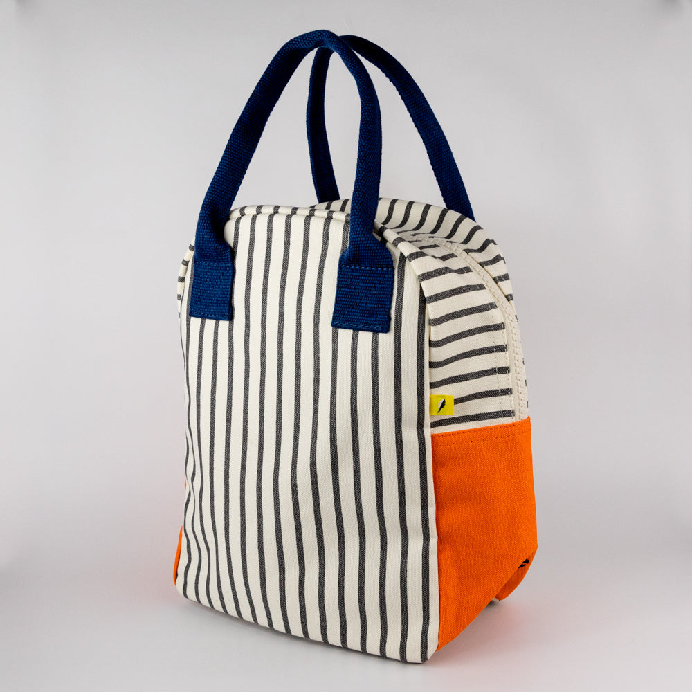 Striped lunch bag with orange bottom and navy handles, featuring a yellow 'fluf' label on a white background.