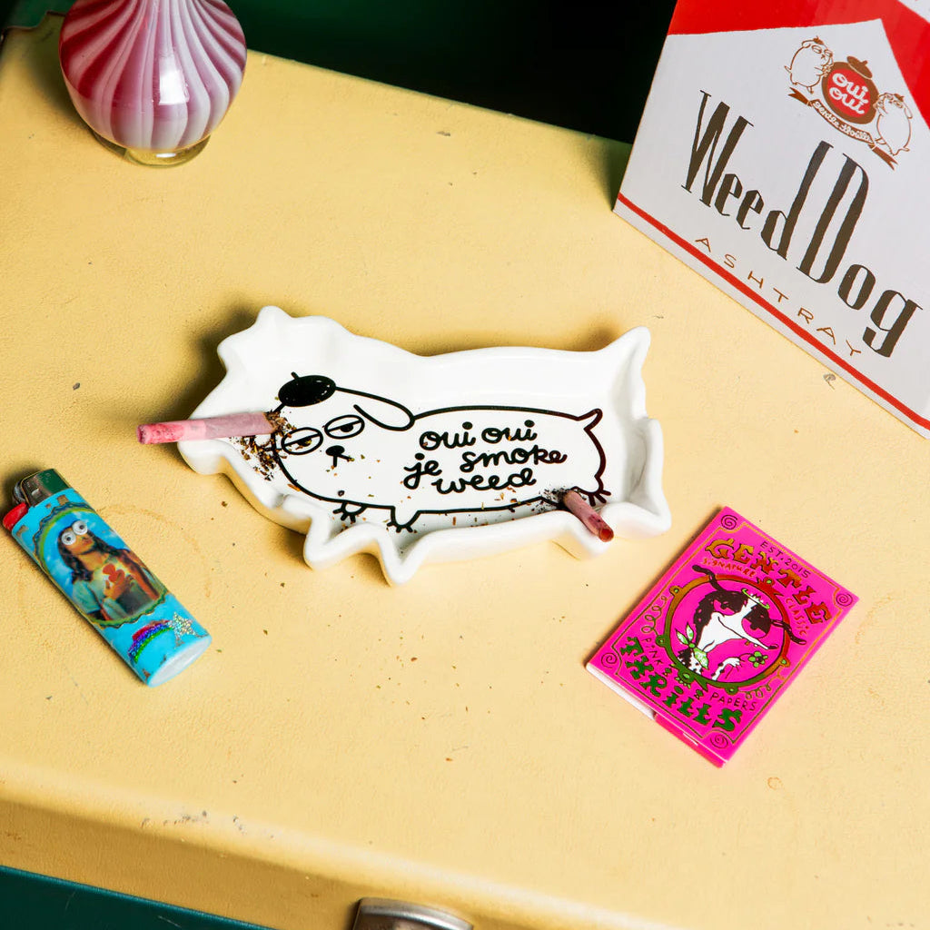 Ceramic ashtray with 'Weed Dog' branding on a white background