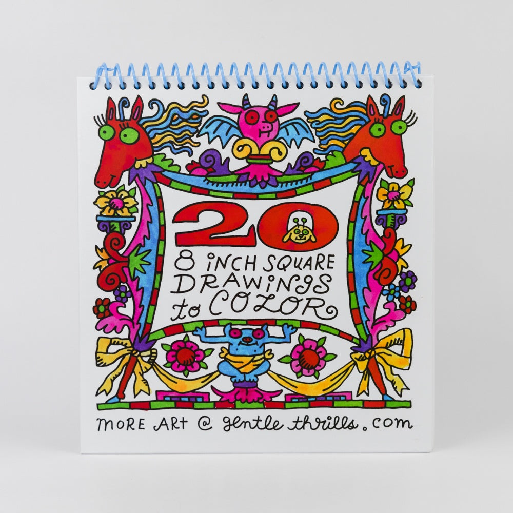 Colorful spiral-bound notebook with decorative cover on a white background
