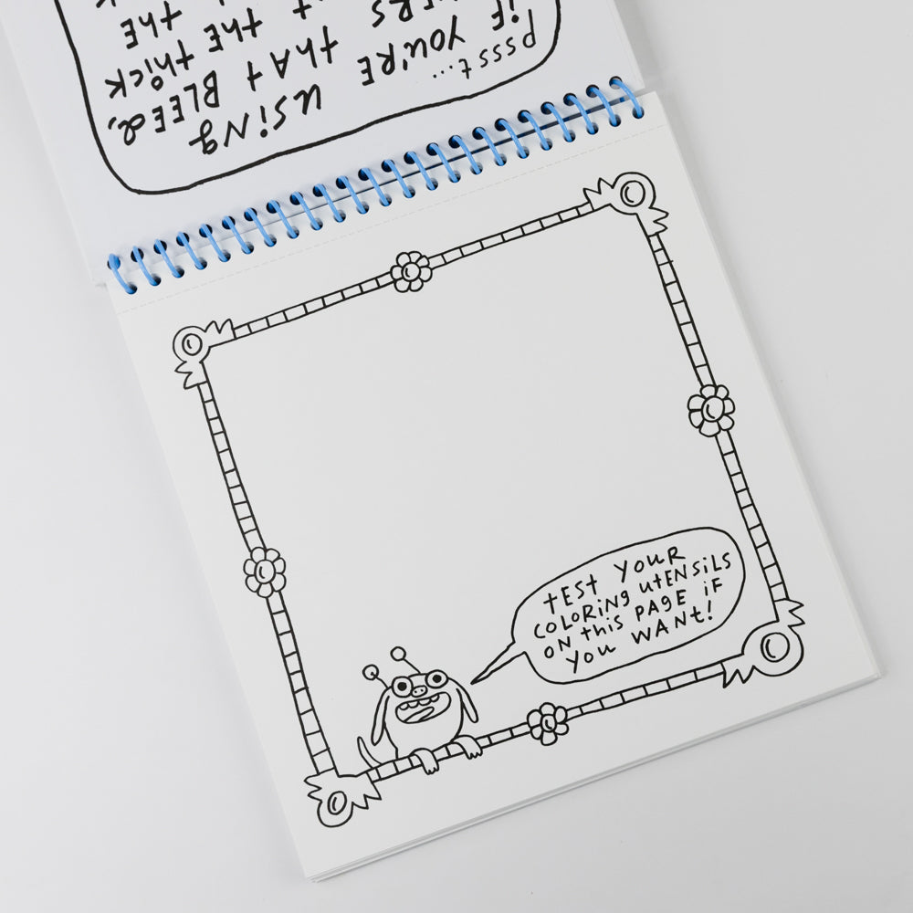 Colorful spiral-bound notebook with decorative cover on a white background