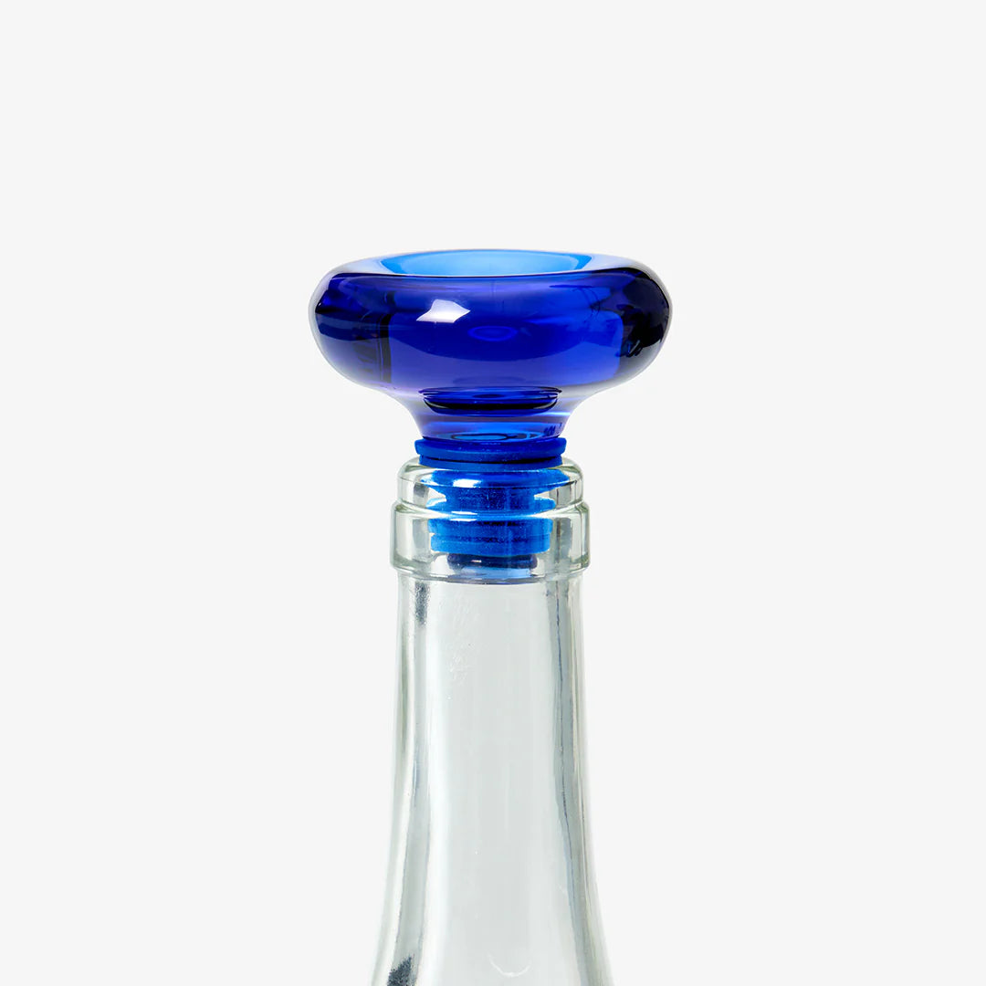 Blue bottle stopper on a white background