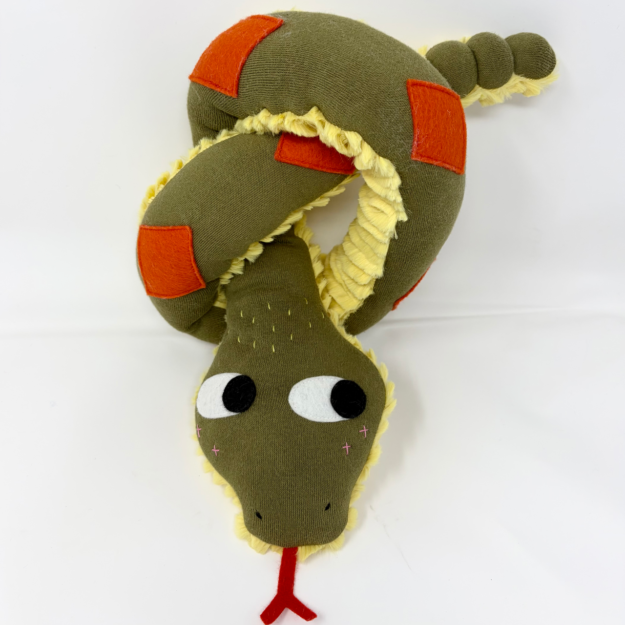 Plush snake toy with a white background