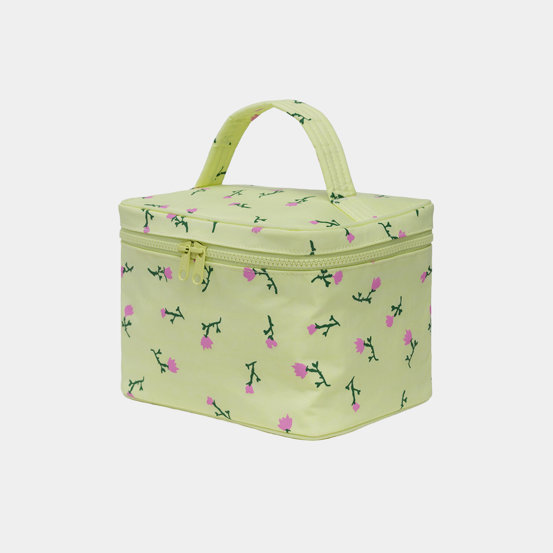 Light green fabric box with floral pattern on a white background