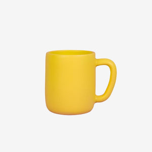 The Citruem Mug by Luvhaus Ceramics is a classic mug shape in a bright yellow, matte finshed.