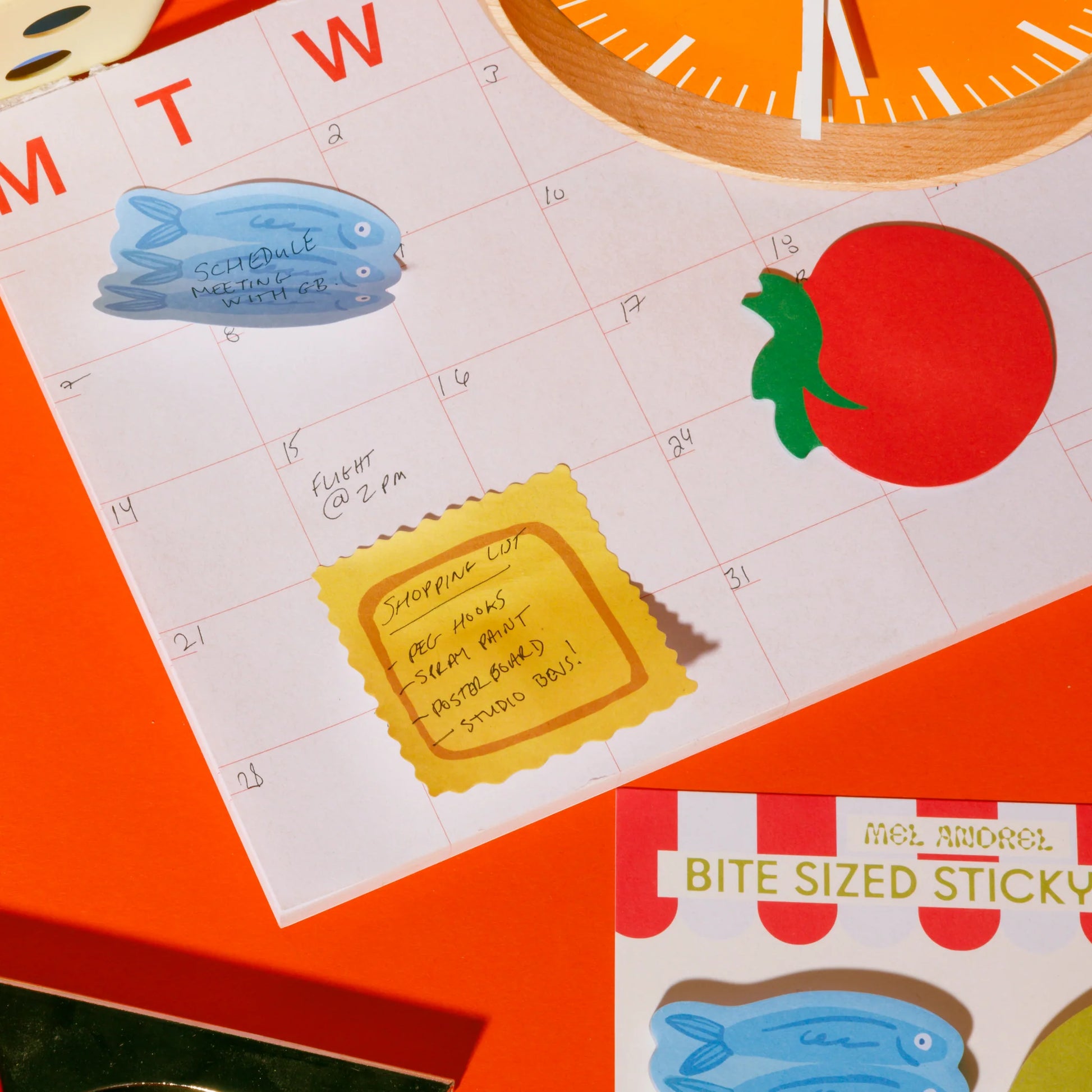 Calendar with decorative sticky notes on a bright orange background