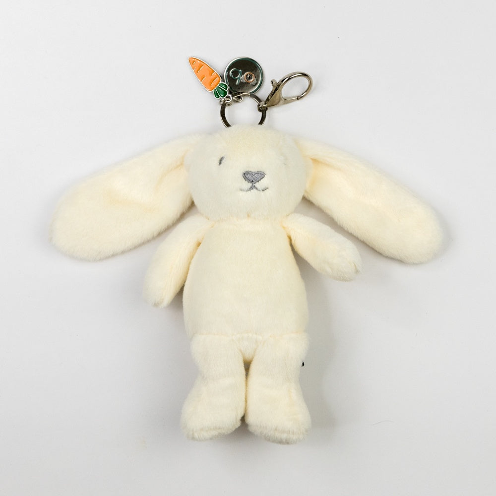 White plush bunny keychain with carrot charm on a white background