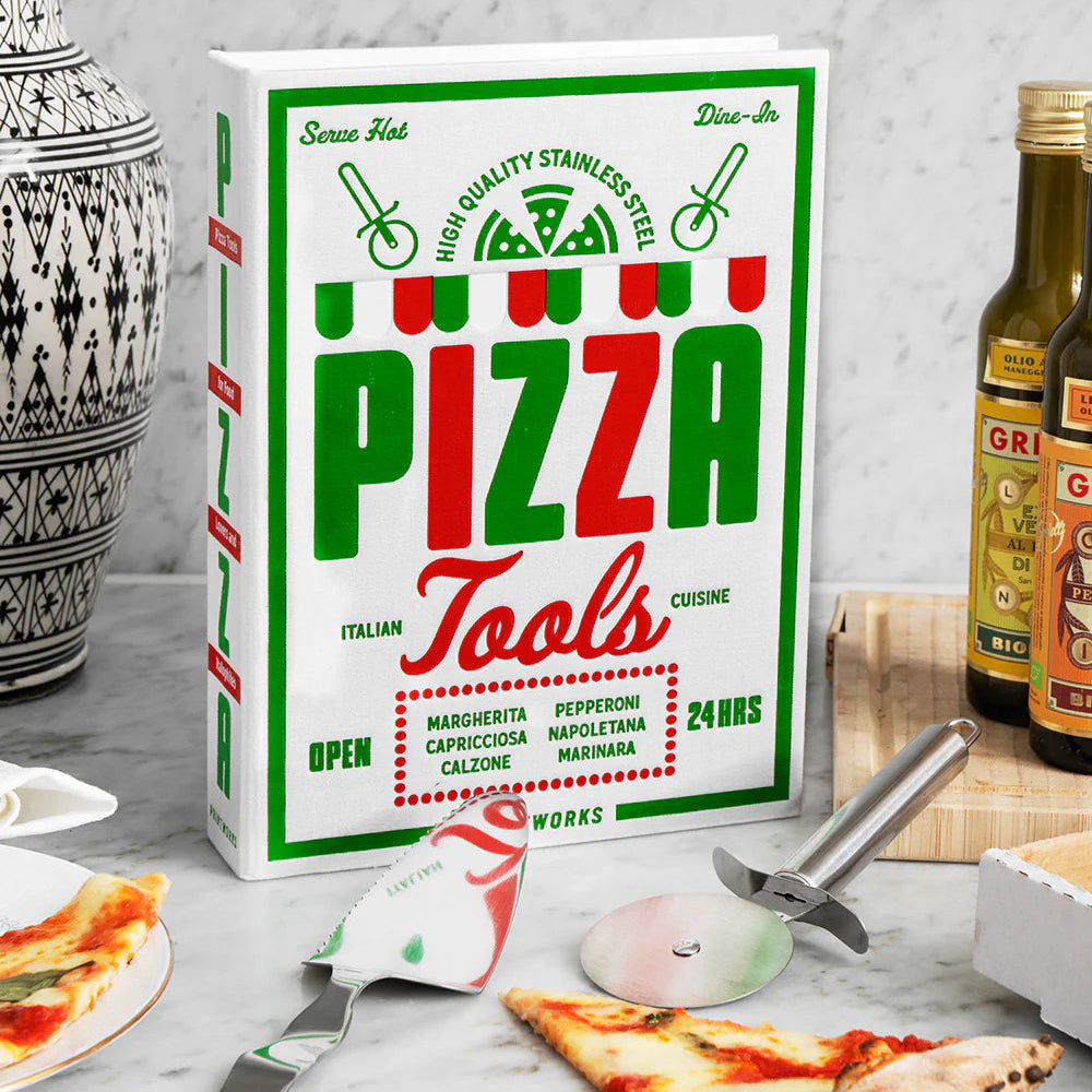 Box of pizza tools with pizza slices and bottles in the background