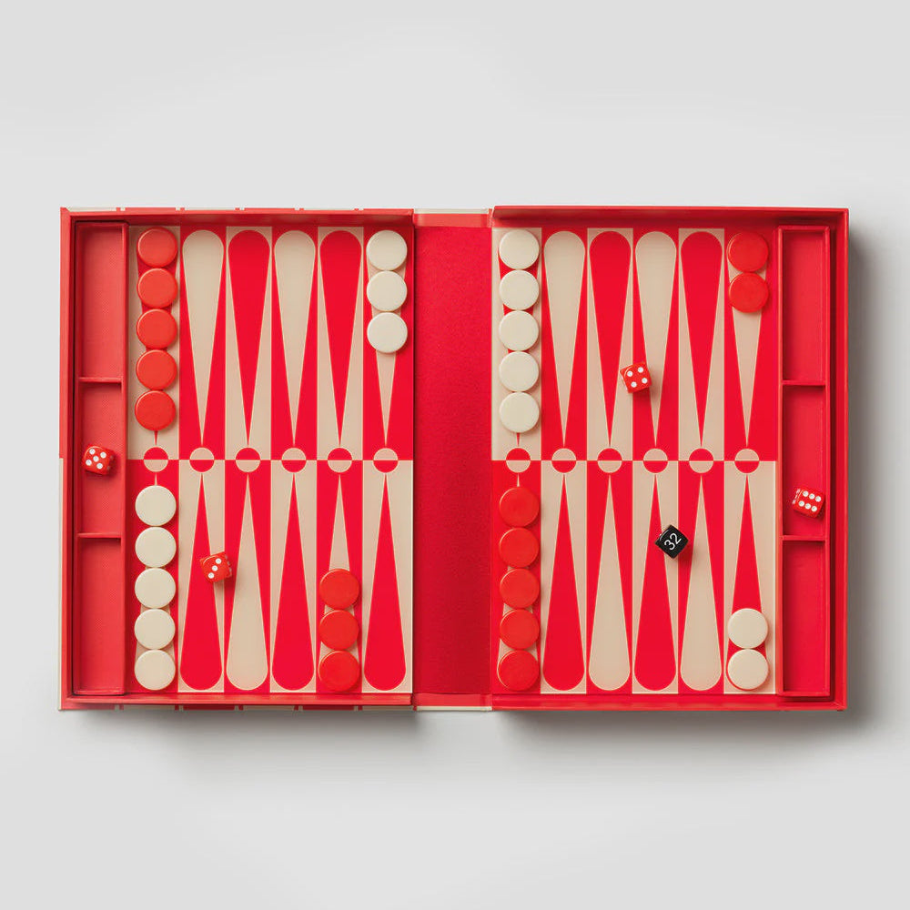 Backgammon set with red and white pieces in a red box on a light gray background