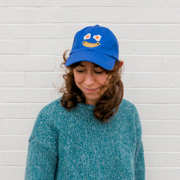 Happy Egg Face Baseball Cap by SMO Ceramics