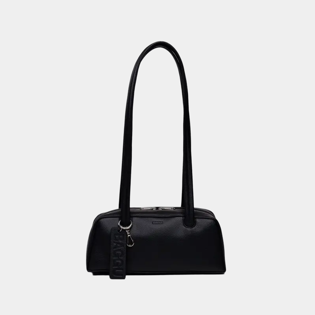Black handbag with a strap on a light gray background
