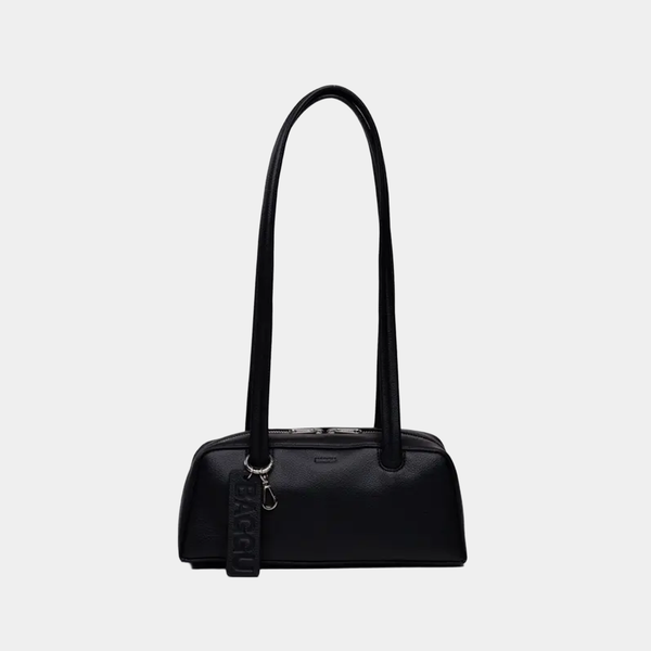 Black handbag with a strap on a light gray background