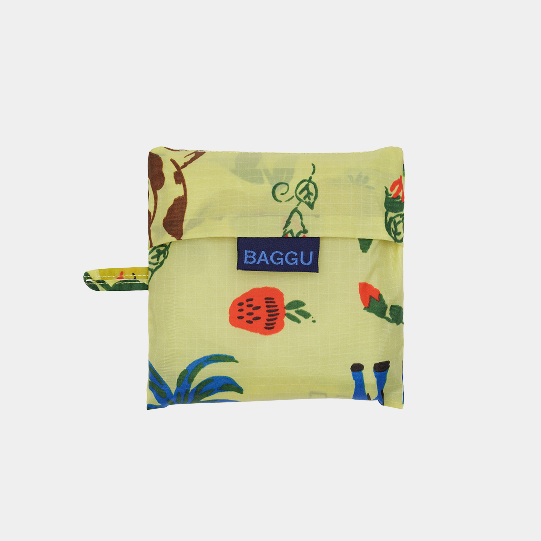 Folded reusable bag with colorful fruit pattern and 'BAGGU' logo on a white background