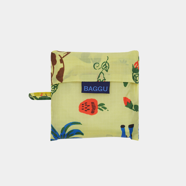Folded reusable bag with colorful fruit pattern and 'BAGGU' logo on a white background