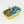 Sardine can-shaped candle with a decorative label on a white background