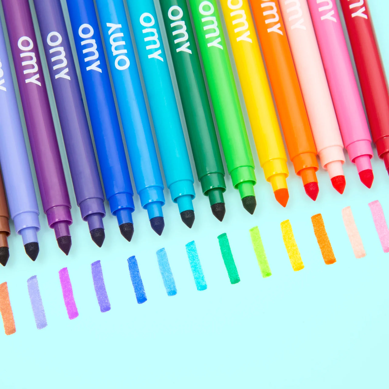 Pack of OMY ultra washable markers with three colored markers on a white background