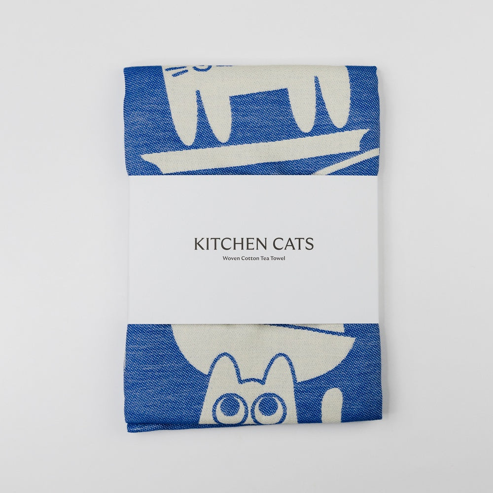 Tea towel with cat design and 'Kitchen Cats' branding on a white background