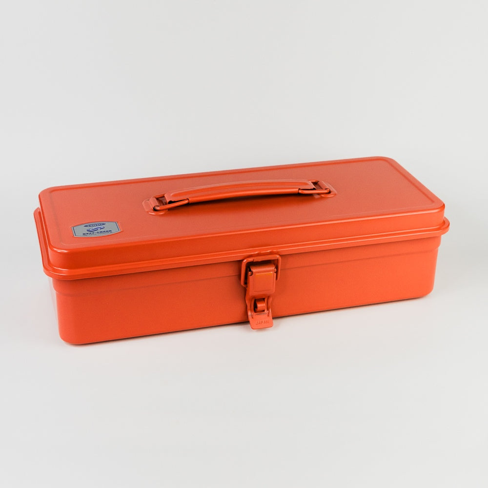 Orange metal toolbox on a light gray background