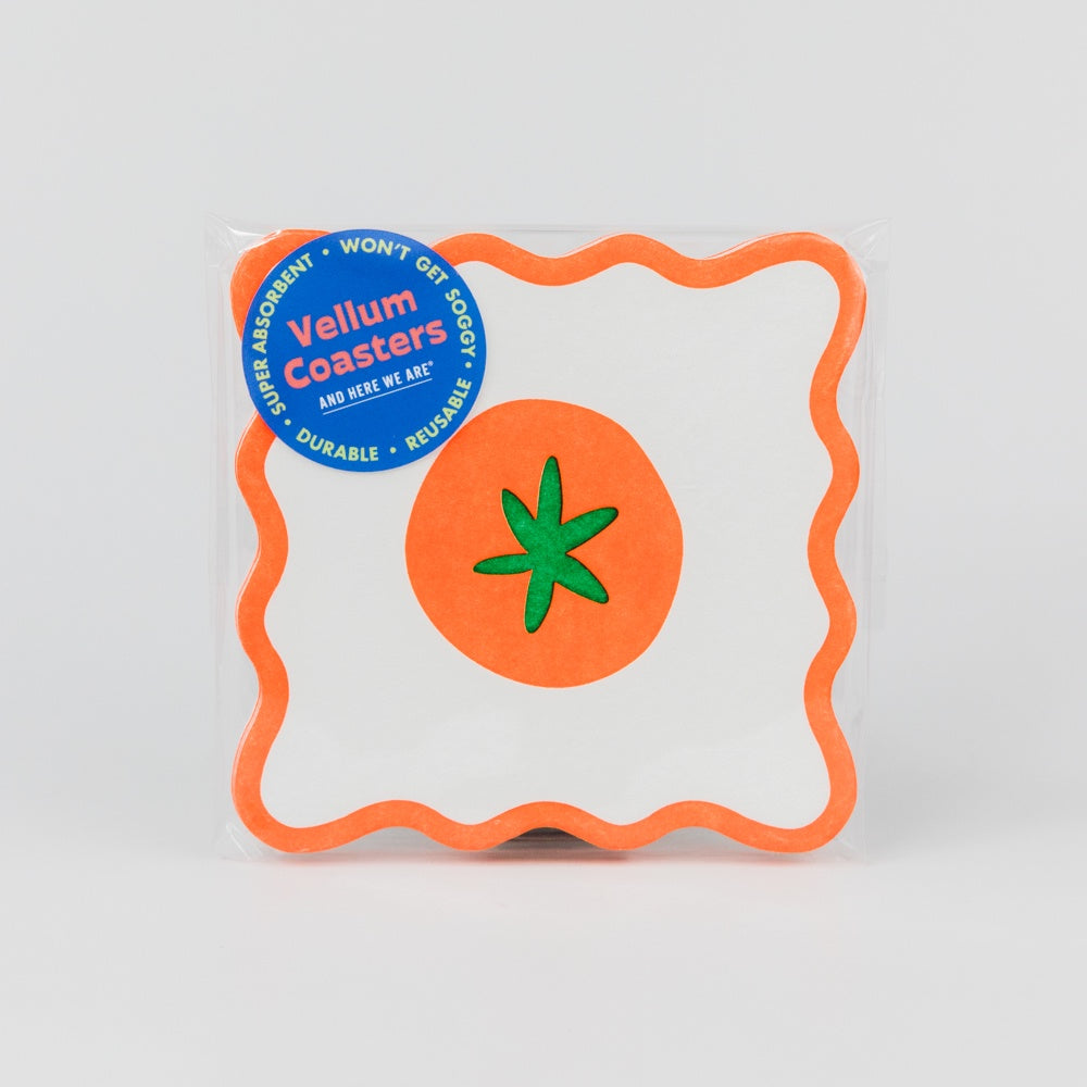 Pack of coasters with a tomato design on a white background