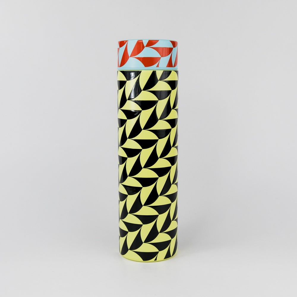 Cylindrical container with geometric pattern on a gray background