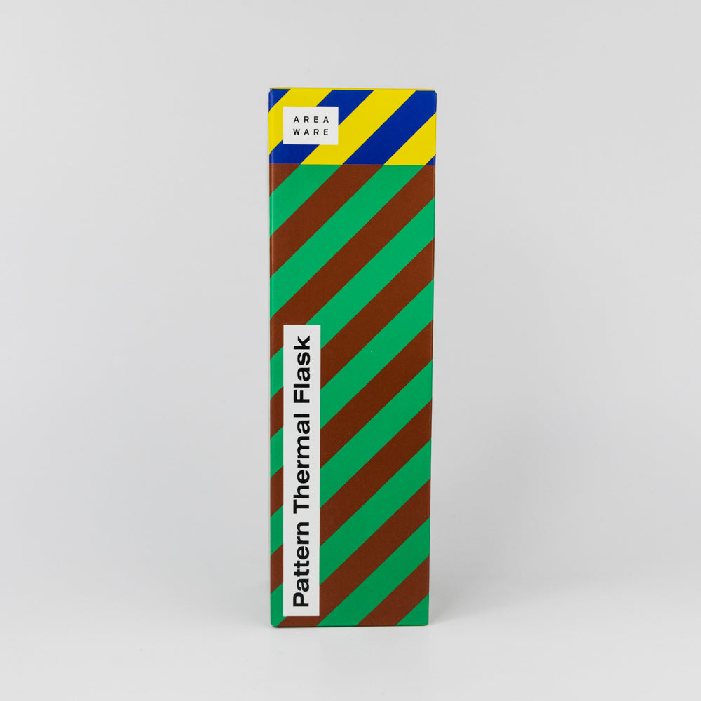 Patterned thermal flask packaging with colorful stripes on a gray background