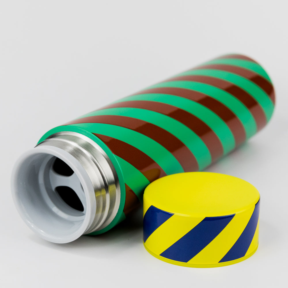 Colorful striped water bottle with a yellow cap on a light gray background
