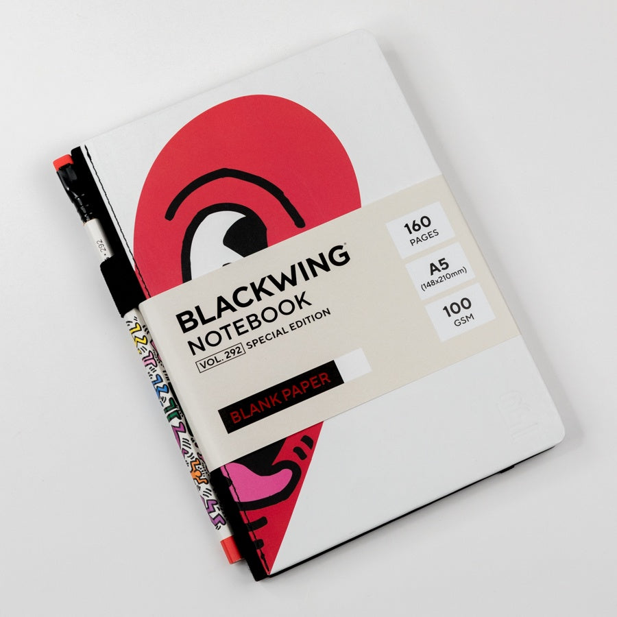 Blackwing notebook with a Keith Haring heart  design on a white background