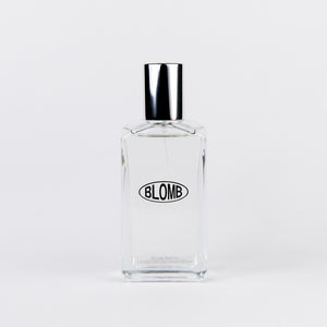 Perfume bottle with silver cap and the word BLOMB on the front