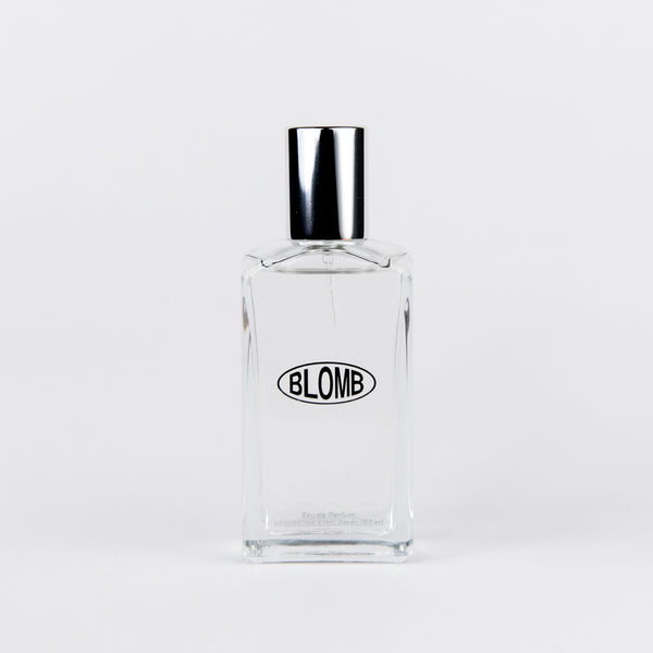 Perfume bottle with silver cap and the word BLOMB on the front