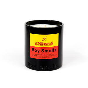 Candle in a black container with a colorful label on a white background