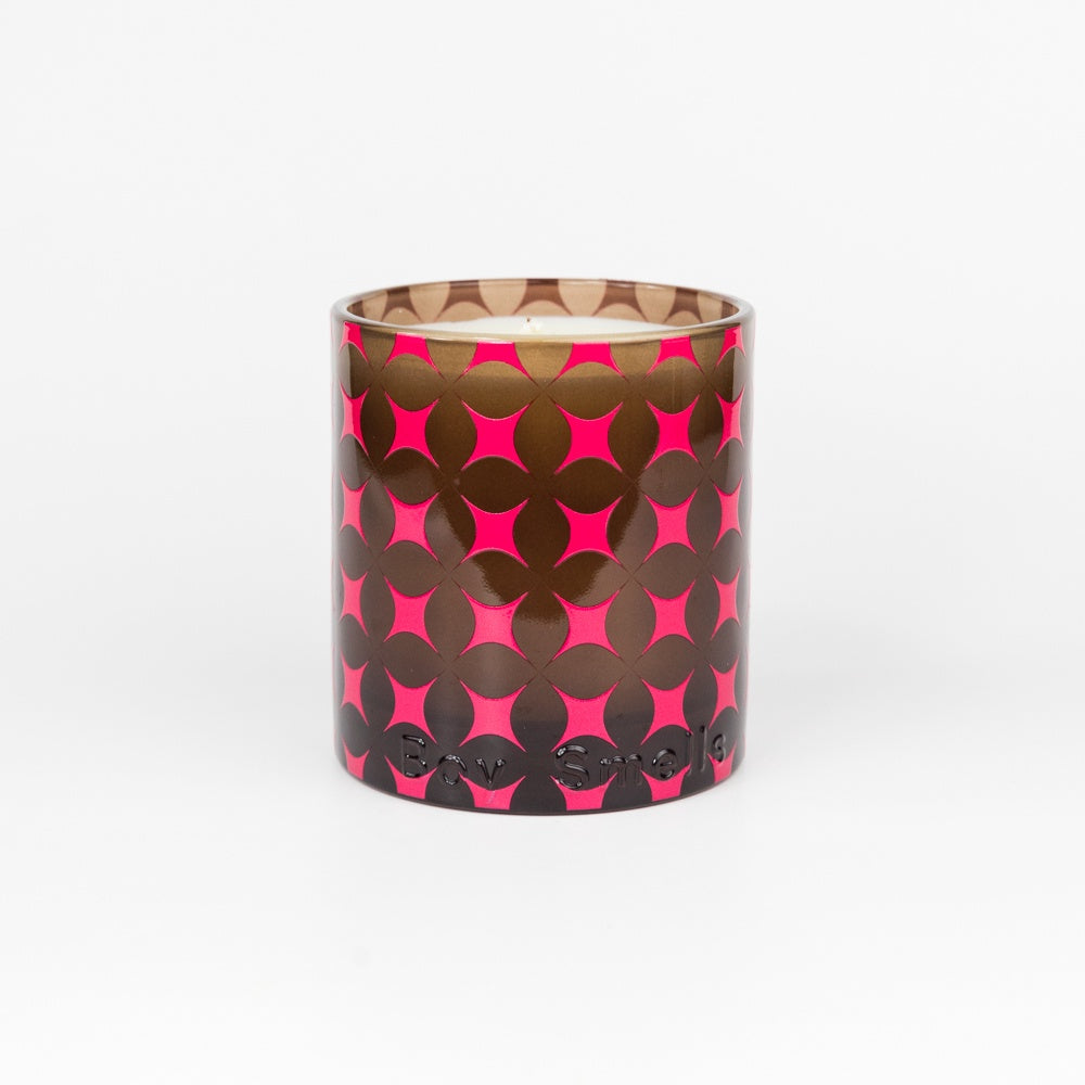 Cylindrical container with pink star pattern on a brown background