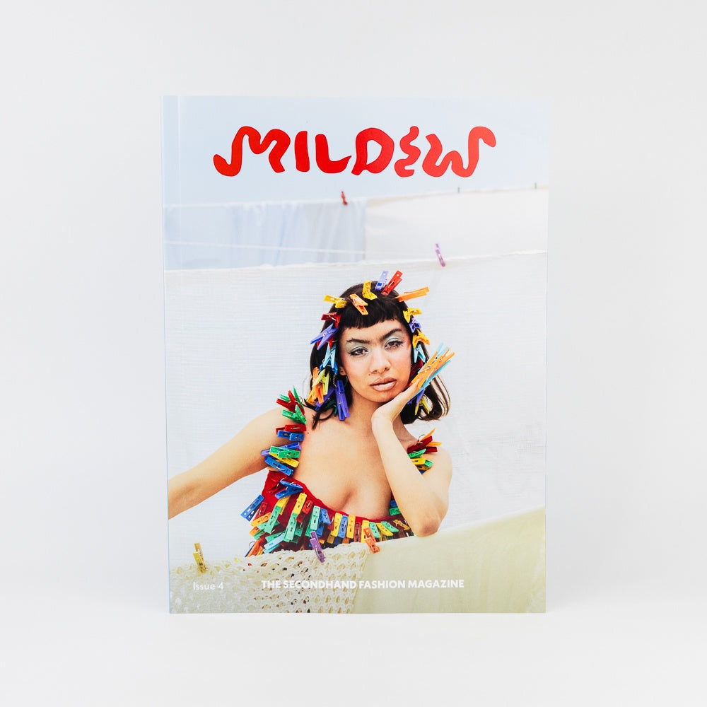 Magazine cover with a colorful headpiece and text on a light background