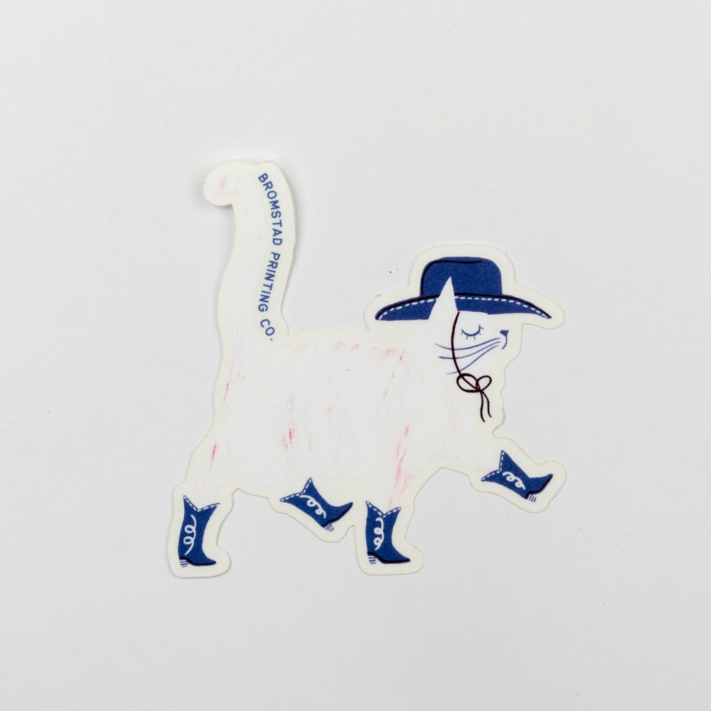 Sticker of a cat wearing a cowboy hat and boots on a white background