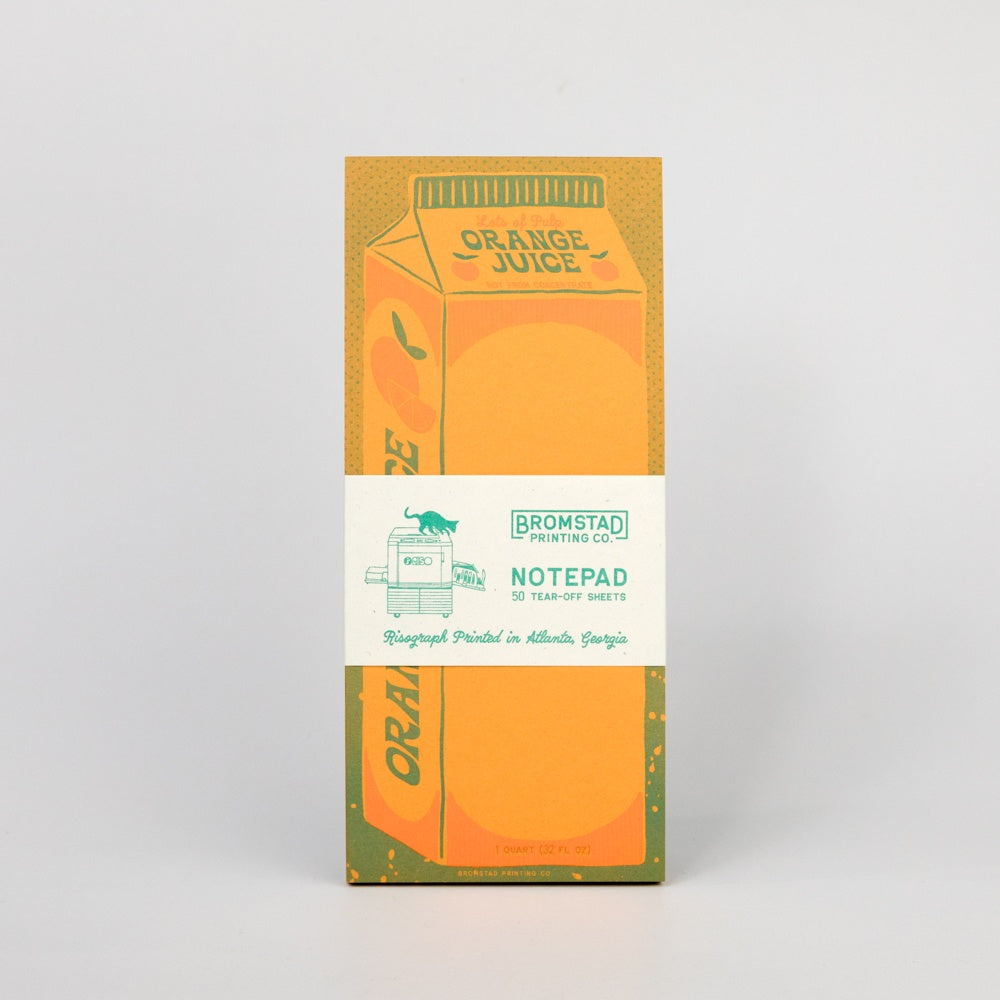 Notepad with orange juice carton design on a white background