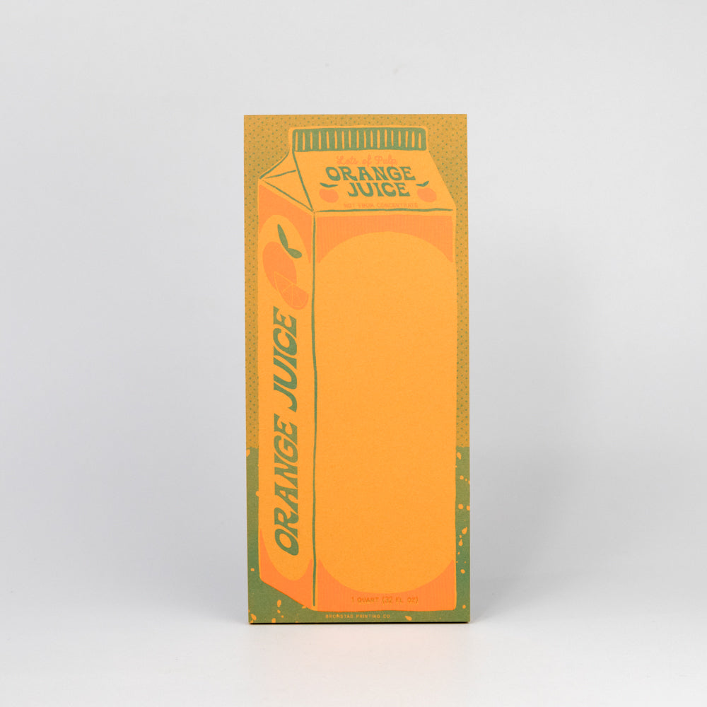 Notepad with orange juice carton design on a white background